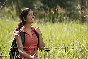 PictureIndia - Young woman hiking in the wilderness