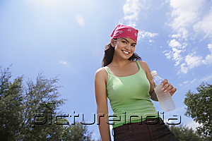 PictureIndia - Young woman with bandana smiling at camera