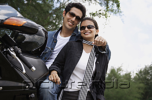 PictureIndia - Young couple with motorbike