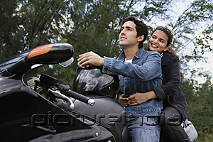 PictureIndia - Young couple riding motorbike