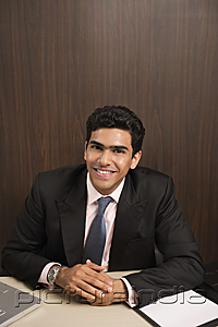 PictureIndia - Businessman smiling at camera