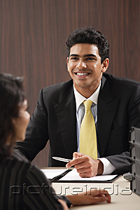 PictureIndia - Businessman smiling at woman